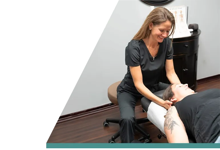 Chiropractor Parker CO Rebecca LaMaack Schwartz Adjusting Patient